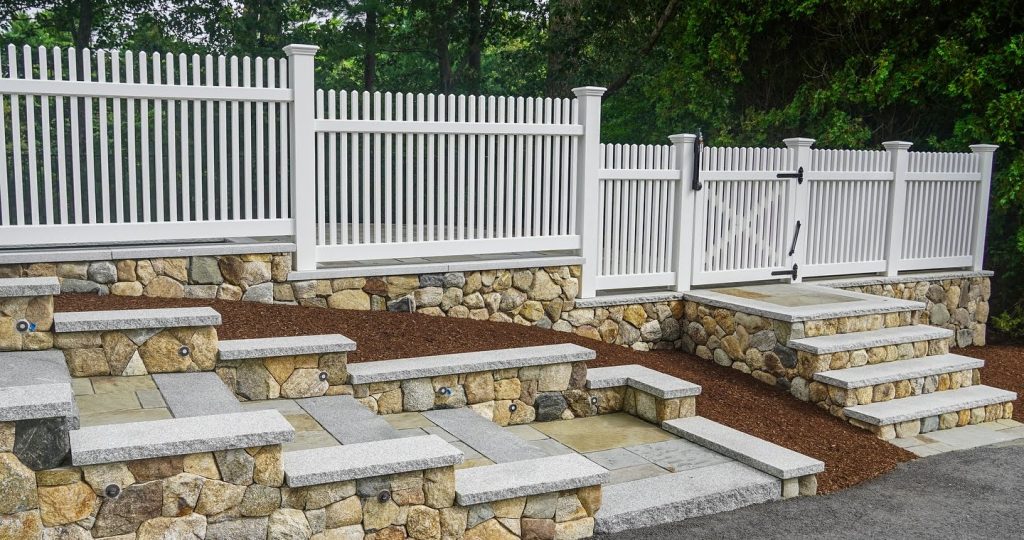 Granite steps with integrated lighting Low-maintenance, stylish vinyl fencing Craftsmanship that boosts property value