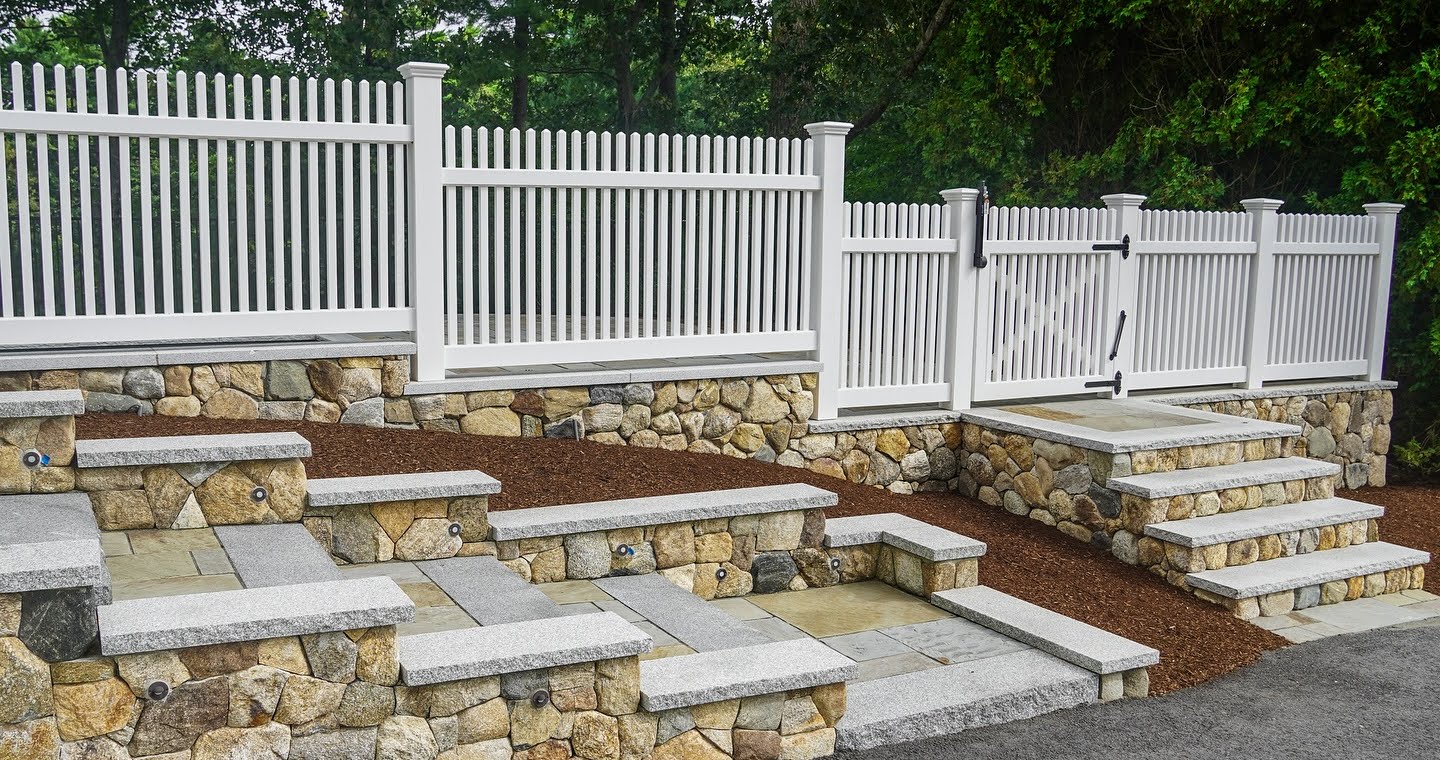 Granite steps with integrated lighting Low-maintenance, stylish vinyl fencing Craftsmanship that boosts property value
